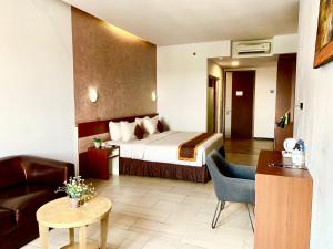 Postel nebo postele na pokoji v ubytování Xtra Hotel Bengkulu