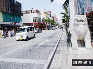 a statue of a lion on the side of a city street at Hotel Abest Naha Kokusai Street in Naha