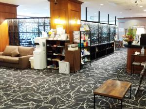 a store lobby with a couch and a table at Hotel Abest Naha Kokusai Street in Naha