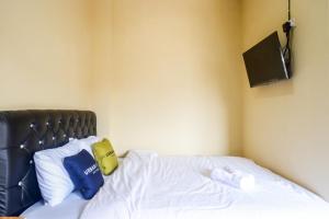 Легло или легла в стая в Urbanview Hotel Telu Wolu Monjali by RedDoorz