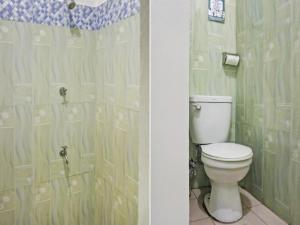 Koupelna v ubytování OYO 868 Solanos Transient House