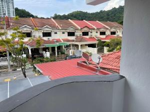 a view of a building with a red roof at Villa Prisha in Bayan Lepas