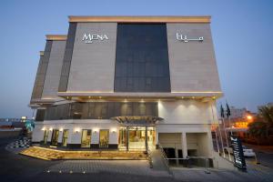 a building with a meza sign on the front of it at Mena East Suites Dammam in Dammam