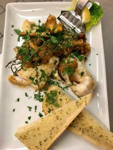 a plate of food with shrimp and vegetables and a tortilla at Landgasthof Fegetasch in Neukirchen