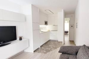 TV a/nebo společenská místnost v ubytování Precioso Apartamento a 3 minutos de la Playa, con parking gratuito