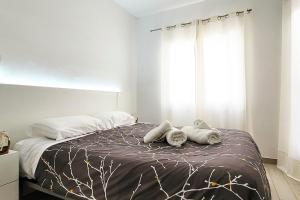 Postel nebo postele na pokoji v ubytování Precioso Apartamento a 3 minutos de la Playa, con parking gratuito