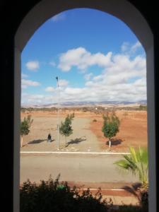a view of a desert from a window at Appartement dans villa in Cite Adrar