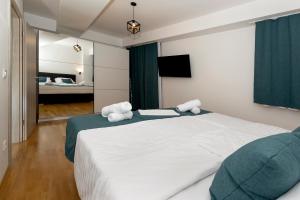 A bed or beds in a room at Gric Apartments