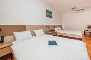 Letto o letti in una camera di Magnolia Place