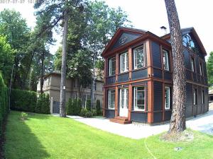 a house with a tree in front of it at Exquisite 1930's Historical House in Jūrmala