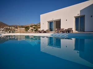 a villa with a swimming pool with a view at Villa Luxury Magic View in Lefkes