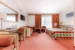 Postel nebo postele na pokoji v ubytování Info Hotel