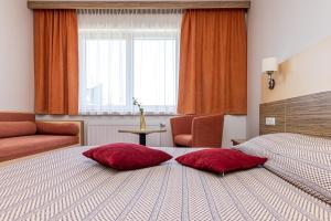 Postel nebo postele na pokoji v ubytování Info Hotel