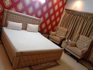 Tempat tidur dalam kamar di Butt Lodges 3