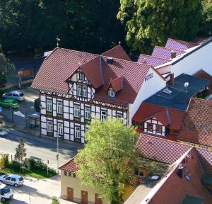 an overhead view of a building with red roofs at Fürstenhof Wernigerode Garni in Wernigerode