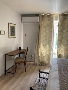 Postel nebo postele na pokoji v ubytování B&B l'Aigrin