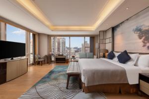 TV a/nebo společenská místnost v ubytování Zhuhai Longzhuda International Hotel