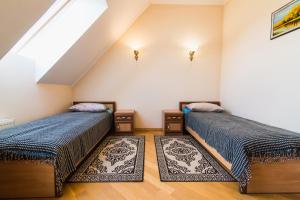 Posteľ alebo postele v izbe v ubytovaní Koncha-Zaspa Spa Hotel