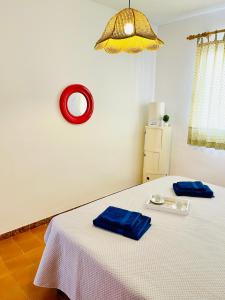 Posteľ alebo postele v izbe v ubytovaní APARTBEACH BALANDRO CLIMATIZADO y VISTAS MAR