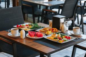 a table with three plates of food on it at Akkan Hotel in Bodrum City
