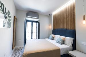 Posteľ alebo postele v izbe v ubytovaní Apartamentos El Patio, Plaza Mayor Trujillo