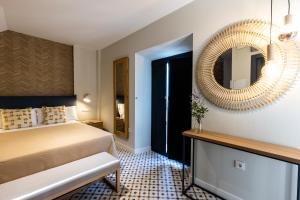 Posteľ alebo postele v izbe v ubytovaní Apartamentos El Patio, Plaza Mayor Trujillo