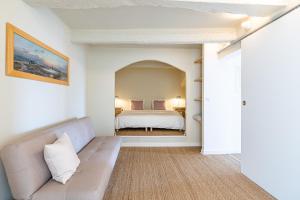 a living room with a couch and a bed at Le Rooftop par Dodo-a-Cassis in Cassis +29 photos