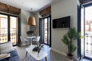Televízia a/alebo spoločenská miestnosť v ubytovaní Apartamentos El Patio, Plaza Mayor Trujillo