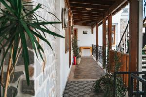 a hallway of a house with a plant at Akkan Hotel in Bodrum City
