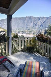 a balcony with a view of the mountains at Vétiver in Cilaos