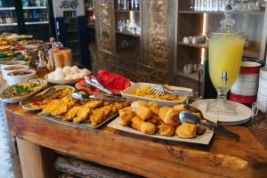 a buffet with food and drinks on a table at Akkan Hotel in Bodrum City