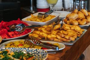 a buffet with many plates of food on a table at Akkan Hotel in Bodrum City