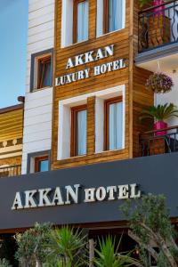 a hotel sign in front of a building at Akkan Hotel in Bodrum City