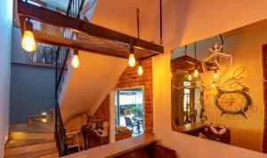 a room with a staircase and a mirror at Akkan Hotel in Bodrum City