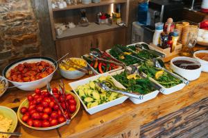 a table topped with lots of different types of food at Akkan Hotel in Bodrum City