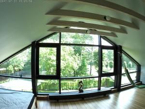 a large glass window in a room with at Exquisite 1930's Historical House in Jūrmala