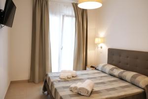Posteľ alebo postele v izbe v ubytovaní Residence Chanel