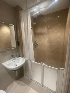 a bathroom with a sink and a shower at Vane House in Osmotherley