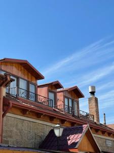 a building with a balcony on top of it at Guest House IBERIA in Mtskheta