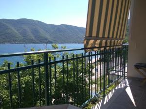 a balcony with a view of a body of water at Apartment Villa Radovic II in Risan +4 photos