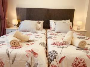 Postel nebo postele na pokoji v ubytování Royal Holiday Home