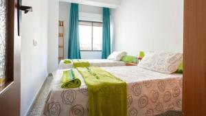 Posteľ alebo postele v izbe v ubytovaní Geranios Wifi en plena Puerta Purchena