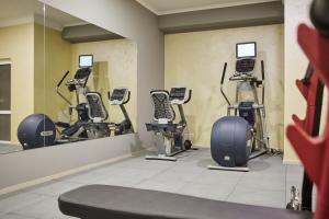 a gym with several exercise bikes in a room at Hotel France in Vinnytsya