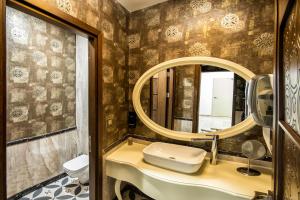 a bathroom with a sink and a mirror at The Conforium Hotel İstanbul in Istanbul