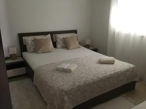 Postel nebo postele na pokoji v ubytování Apartmani Ruzmarin