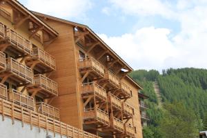 a building with balconies on the side of it at SNC Sainte Marie in Vars