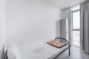 سرير أو أسرّة في غرفة في Vonder: City Walk