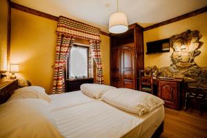 Postel nebo postele na pokoji v ubytování Hotel Jumeaux