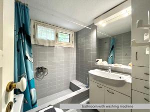 a bathroom with a sink and a toilet and a shower at #Villa Niovi by halu! Sani Villas in Sani Beach