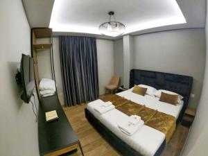Katil atau katil-katil dalam bilik di HOTEL BRAXTON